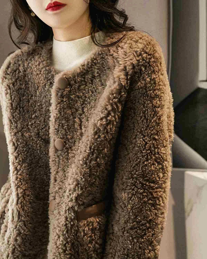 Emily glamorous faux fur coat for women by Christine Brewer, shown in a cozy, stylish design with plush fur texture.