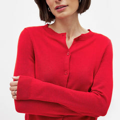 Women’s knit cardigan by Christine Brewer, styled in soft, cozy fabric with a button-up front and long sleeves.