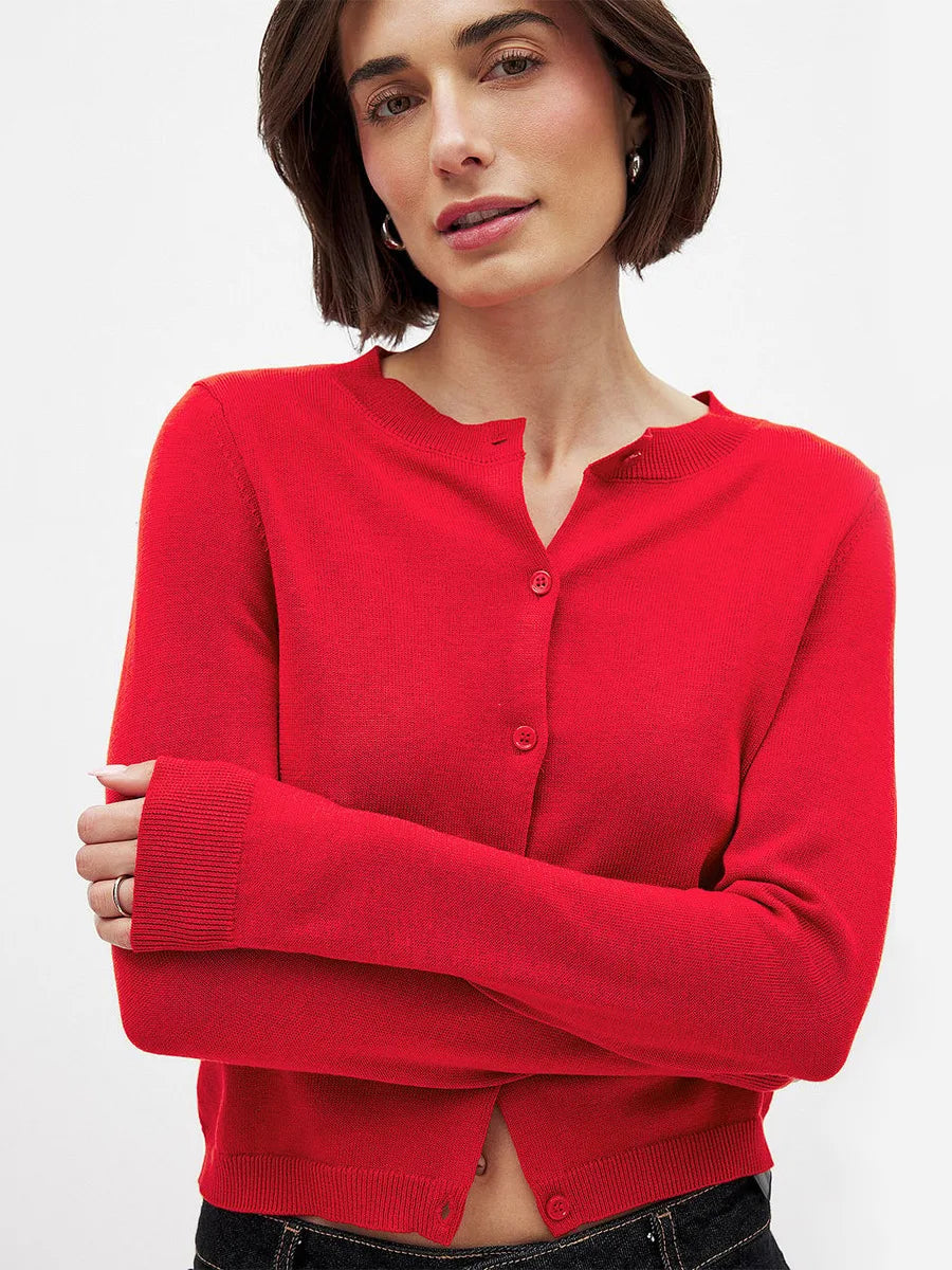 Women’s knit cardigan by Christine Brewer, styled in soft, cozy fabric with a button-up front and long sleeves.