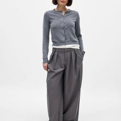 Women’s knit cardigan by Christine Brewer, featuring a cozy, button-up design in a soft, neutral color.