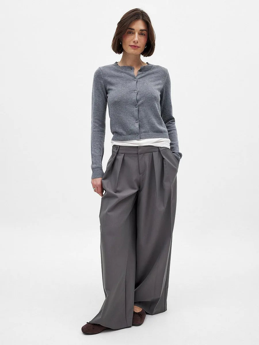 Women’s knit cardigan by Christine Brewer, featuring a cozy, button-up design in a soft, neutral color.