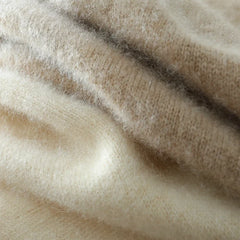 Cream-colored Helen cashmere sweater for women by Christine Brewer, featuring a cozy, relaxed fit and soft knit texture.