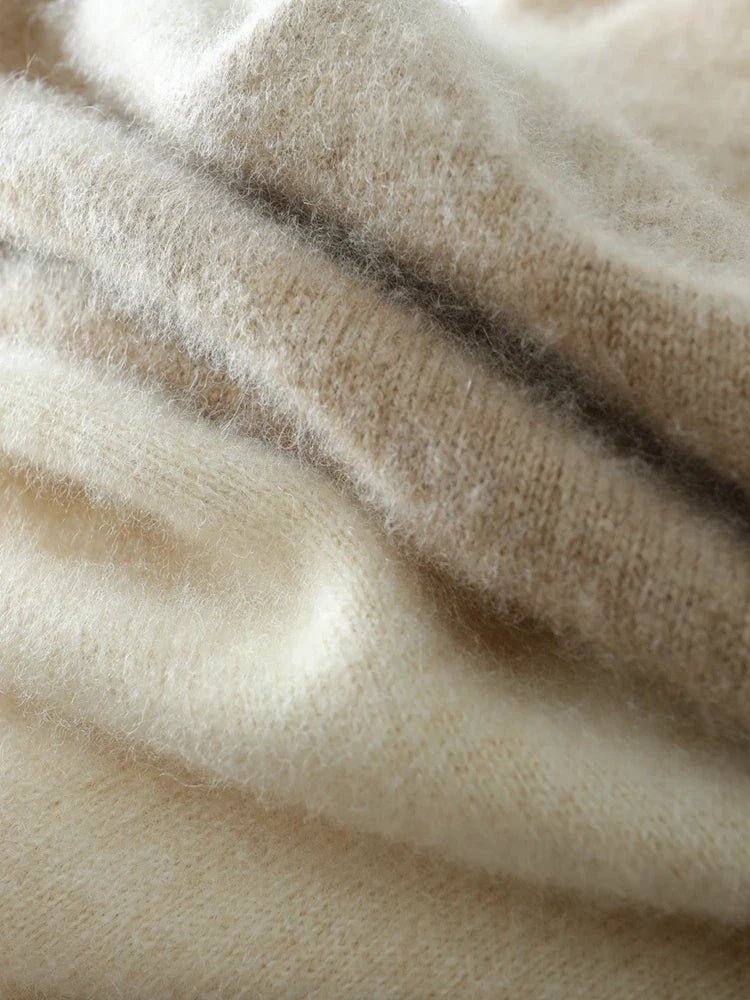 Cream-colored Helen cashmere sweater for women by Christine Brewer, featuring a cozy, relaxed fit and soft knit texture.