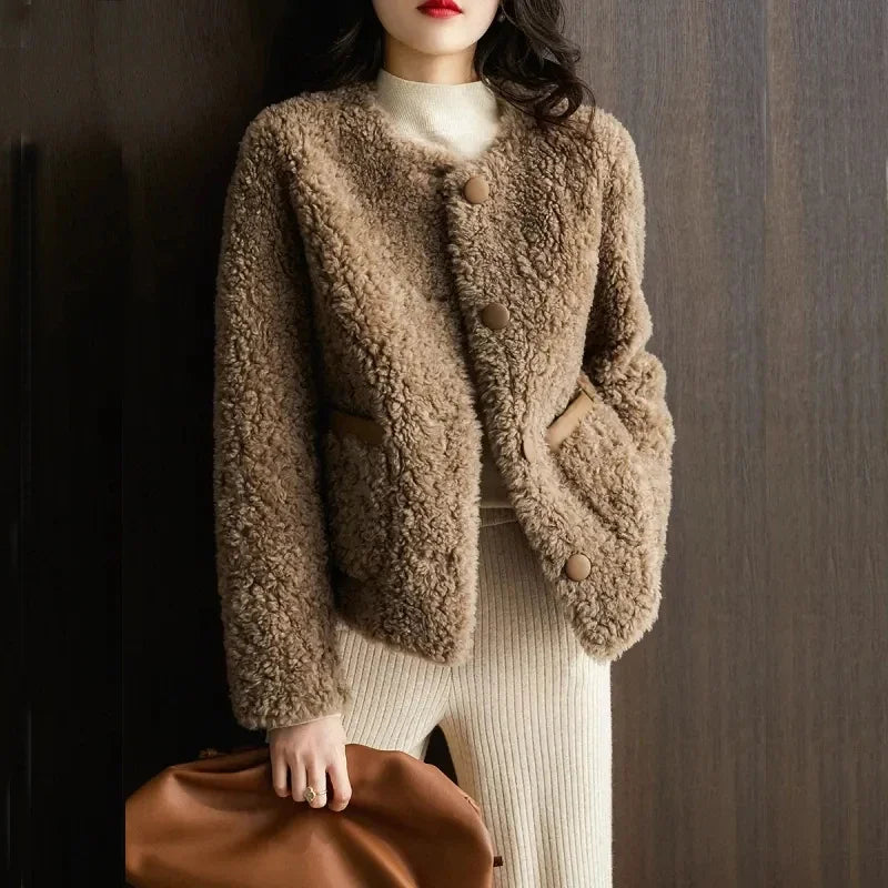Emily glamorous faux fur coat for women by Christine Brewer, shown in a stylish, plush fur exterior with a cozy, fashionable fit.