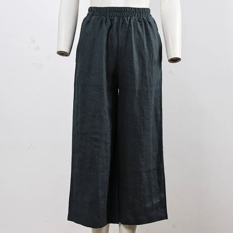 Light beige linen cropped wide-leg drawstring trousers for women, loose pull-on style by Christine Brewer.