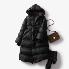 Christine Brewer Ella long belted puffer jacket for women, showcasing a stylish, insulated winter coat with a belt and quilted design.
