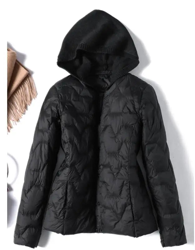 Christine Brewer Zoe women's hooded quilted puffer jacket, featuring a stylish quilted design and cozy hood for cold weather.