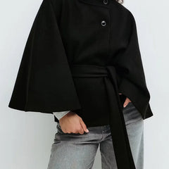 Emma belted cape coat for women by Christine Brewer, shown in a stylish, draped fabric with a belt at the waist.
