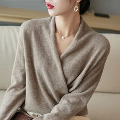 Cream-colored Gwen cashmere V-neck sweater for women by Christine Brewer, soft fabric and classic style, shown on a model.