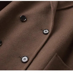 Brown double-breasted wool coat for women by Christine Brewer, featuring classic lapels and tailored fit.