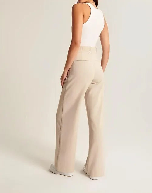 White wide-leg high-waist women's trousers by Christine Brewer, featuring a relaxed fit and elegant high-rise design.