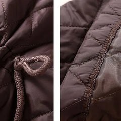 Longline puffer jacket for women by Christine Brewer, featuring a stylish, insulated design perfect for cold weather.