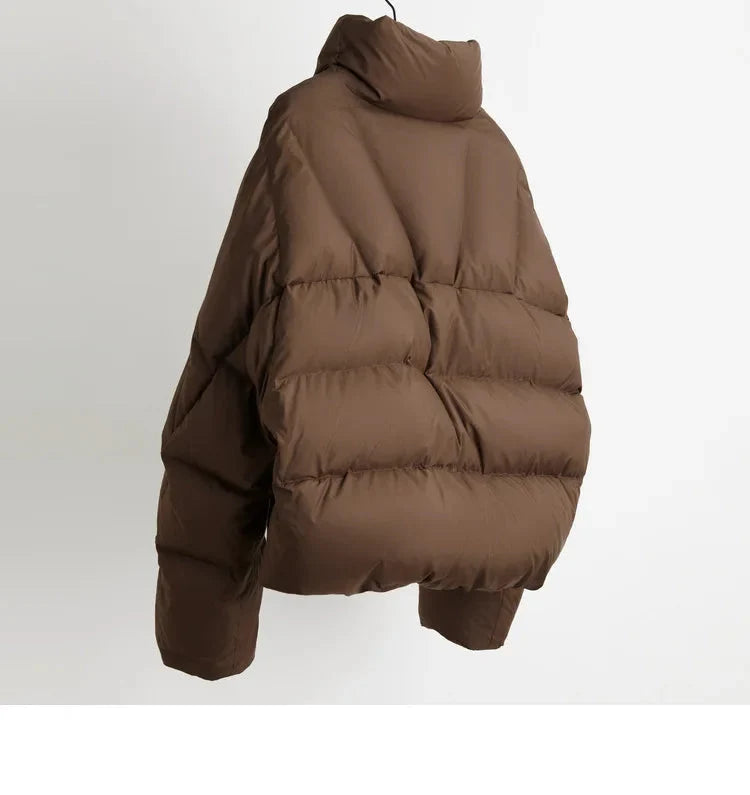 Women's cropped quilted parka jacket by Christine Brewer, stylish outerwear with a quilted design and warm insulation.
