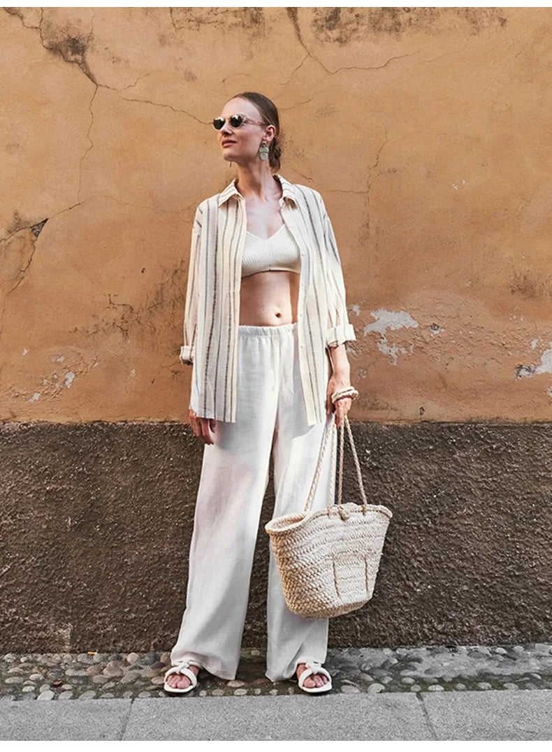 Women’s knit wide-leg drawstring trousers by Christine Brewer, featuring a loose fit and pull-on style in a soft, comfortable fabric.