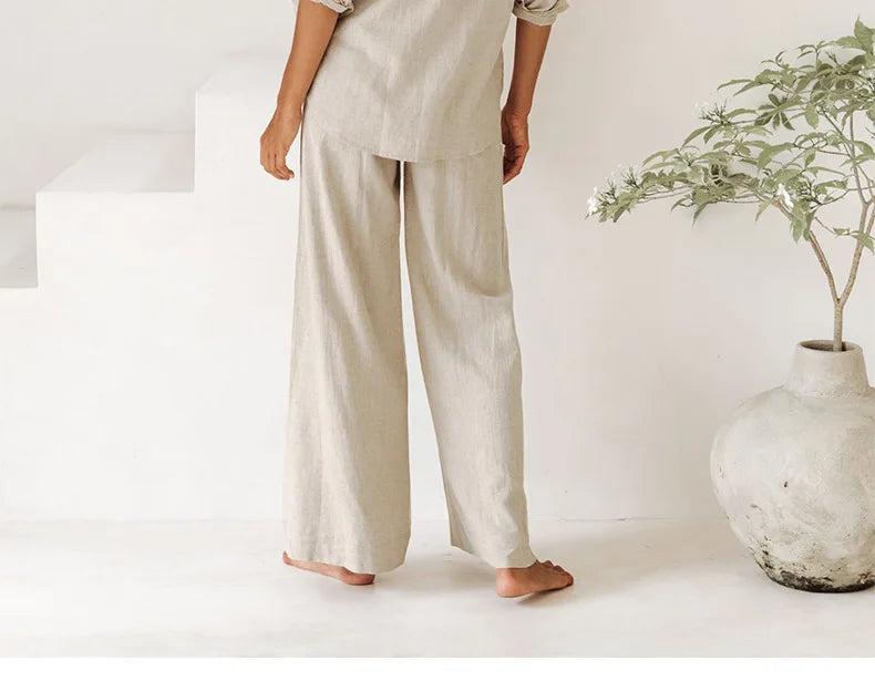 Women’s linen wide-leg trousers by Christine Brewer, loose pull-on pants with relaxed fit in light, breathable fabric.