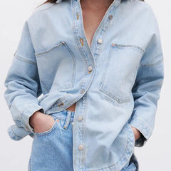 Women’s relaxed denim shirt jacket by Christine Brewer, featuring classic blue denim and casual fit.
