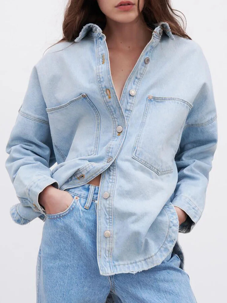 Women’s relaxed denim shirt jacket by Christine Brewer, featuring classic blue denim and casual fit.