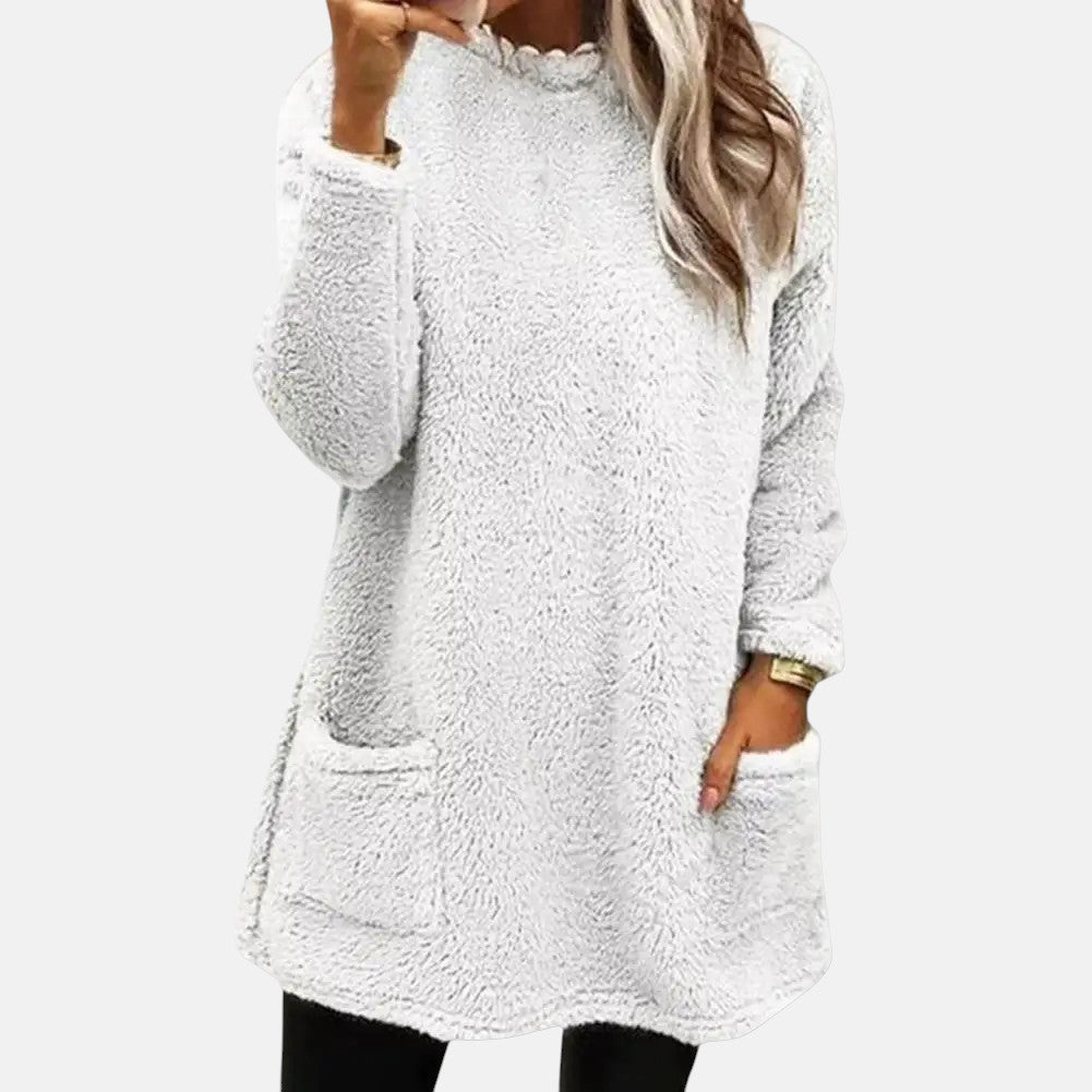 Pink knit sweater for women from Christine Brewer's Estelle collection, featuring a cozy, textured design and long sleeves.