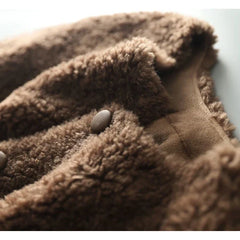 Emily glamorous faux fur coat for women by Christine Brewer, shown in a stylish close-up with soft, luxurious faux fur texture.