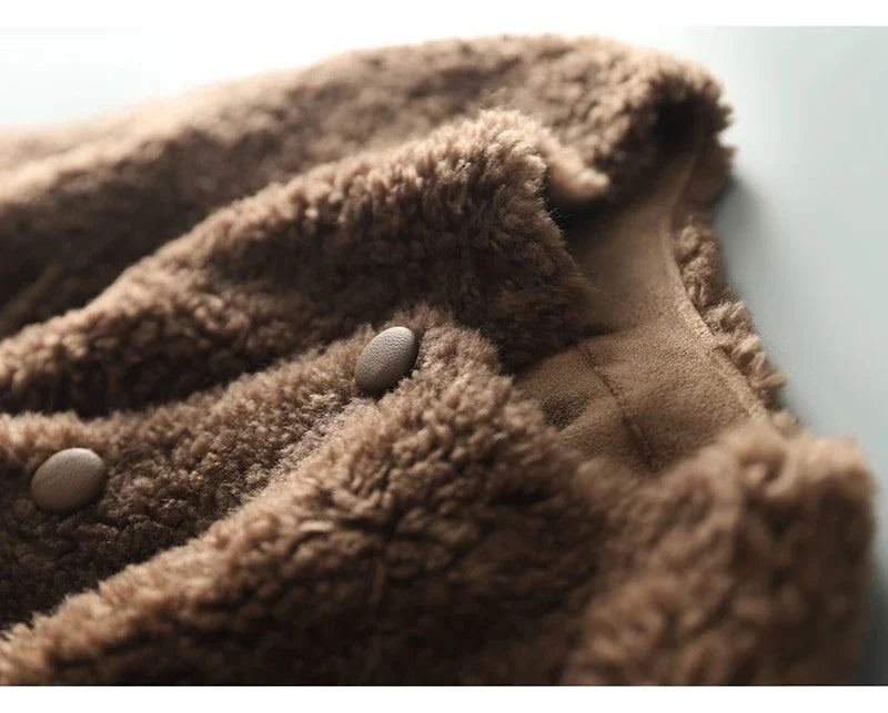 Emily glamorous faux fur coat for women by Christine Brewer, shown in a stylish close-up with soft, luxurious faux fur texture.