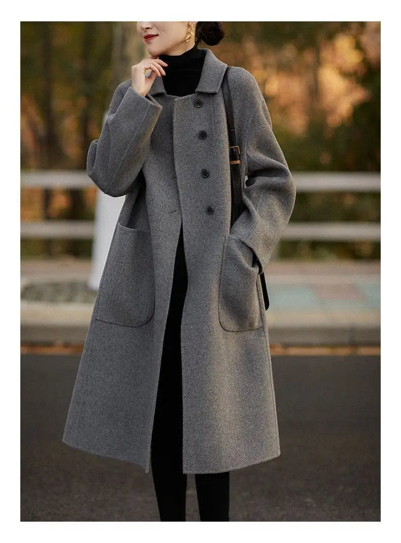 Green long wool coat for women by Christine Brewer, featuring a stylish and cozy design perfect for cold weather.