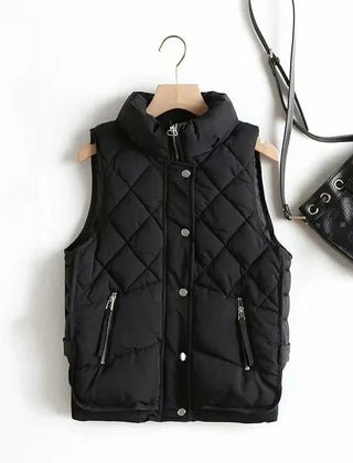Ruby stand collar puffer vest for women by Christine Brewer, shown in a sleek, quilted design with a stand collar.