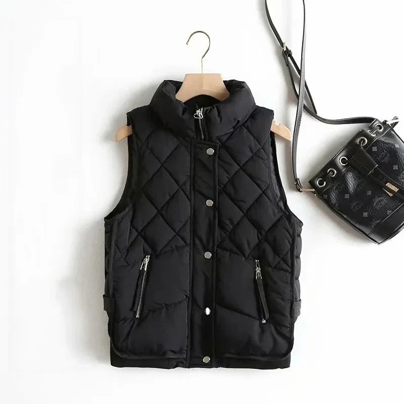 Ruby stand collar puffer vest for women by Christine Brewer, shown in a sleek, quilted design with a stand collar.