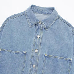 Relaxed denim shirt jacket for women by Christine Brewer, featuring classic blue denim, button front, and casual fit.