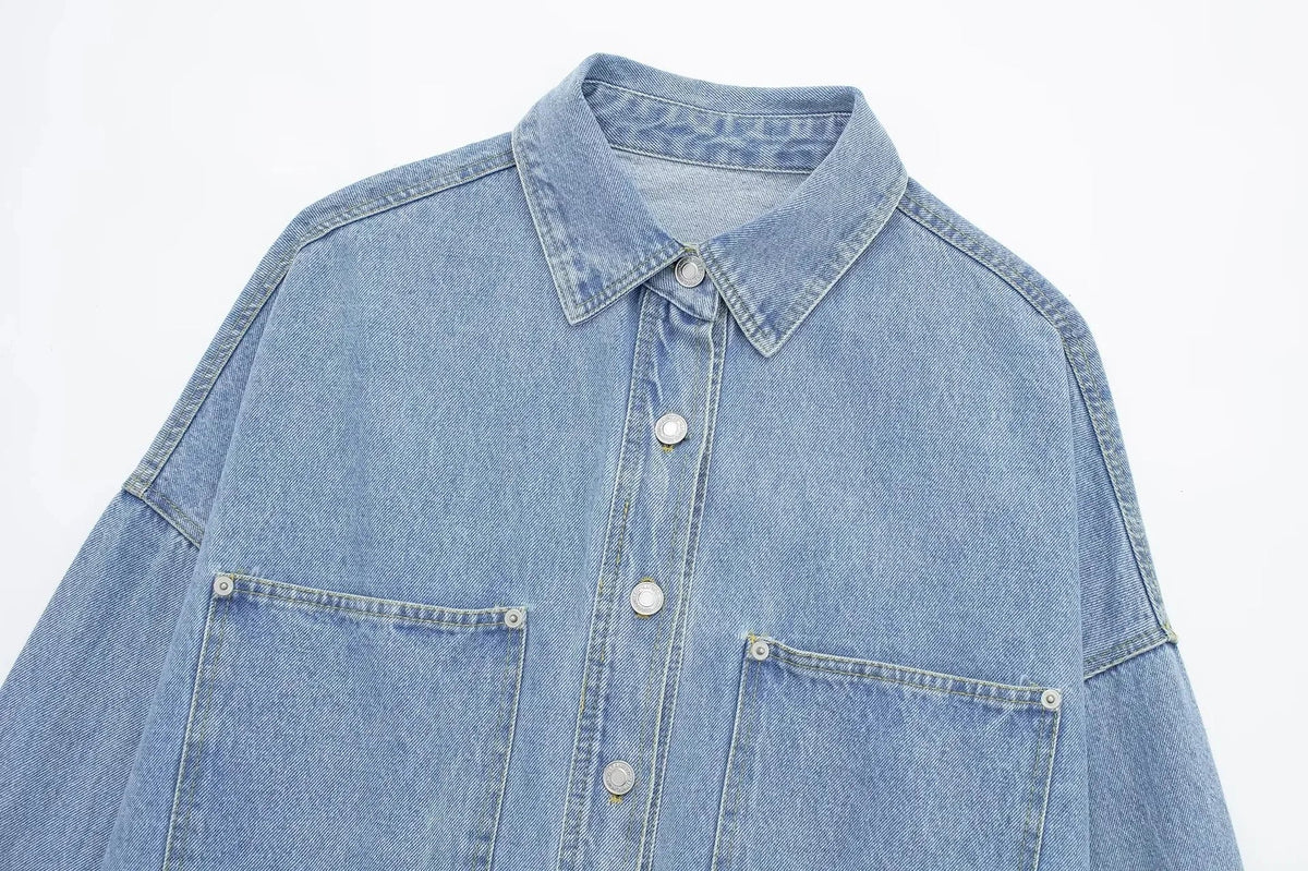 Relaxed denim shirt jacket for women by Christine Brewer, featuring classic blue denim, button front, and casual fit.