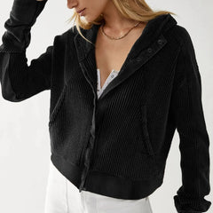 Christine Brewer Mia cropped hooded hoodie for women, showing the stylish hood and relaxed fit in a casual outdoor setting.