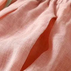 Women’s tapered linen trousers by Christine Brewer, loose pull-on pants with a relaxed fit and casual style.