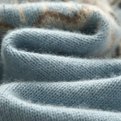 Cream-colored cashmere mock neck sweater for women by Christine Brewer, featuring a cozy, stylish fit and soft texture.