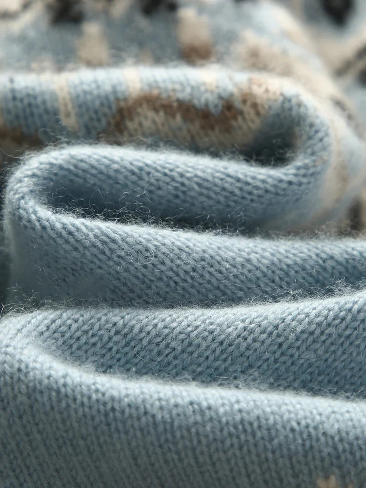 Cream-colored cashmere mock neck sweater for women by Christine Brewer, featuring a cozy, stylish fit and soft texture.