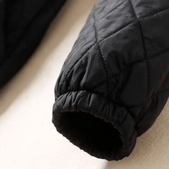 Longline puffer jacket for women by Christine Brewer, featuring a stylish, warm, and insulated Elena puffer coat with a sleek design.