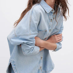 Nora relaxed denim shirt jacket for women by Christine Brewer, shown in classic blue denim with button closure and collar.