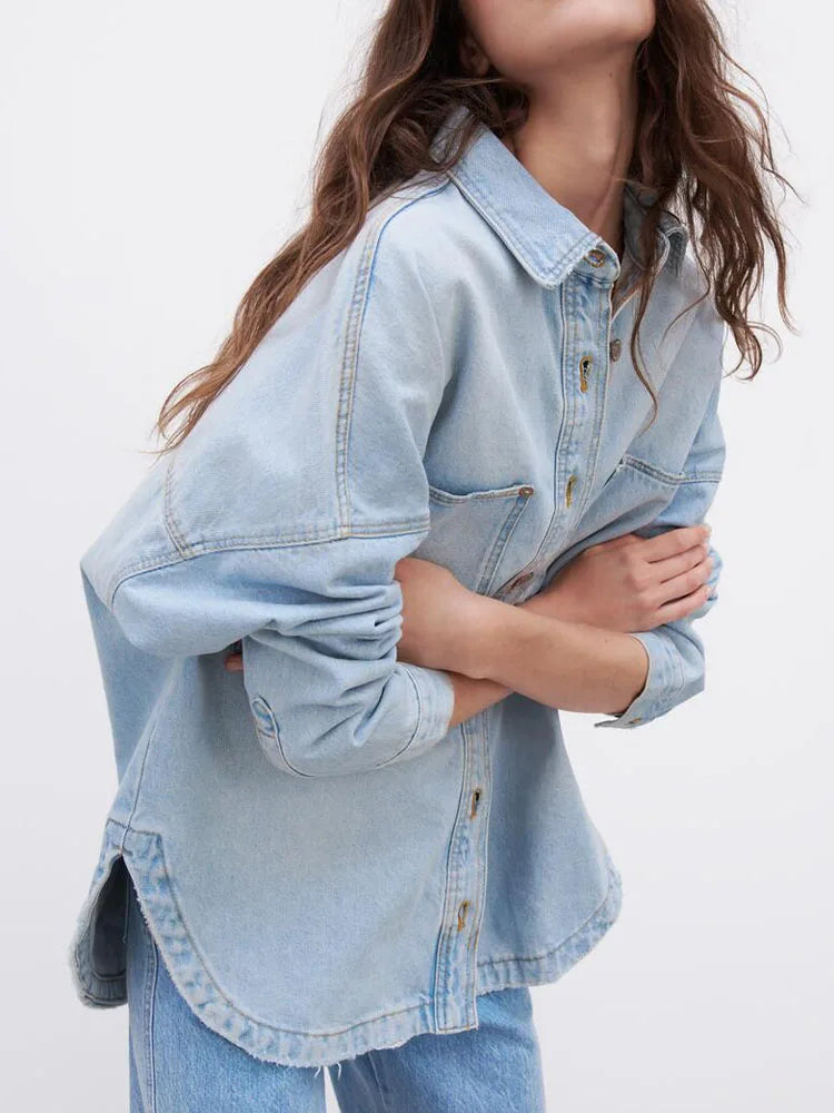 Nora relaxed denim shirt jacket for women by Christine Brewer, shown in classic blue denim with button closure and collar.