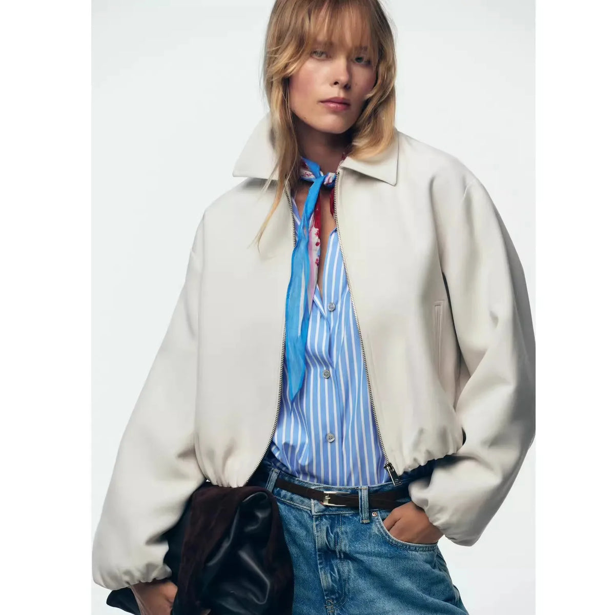 Violet zip-up puffer jacket for women by Christine Brewer, featuring a quilted design and stand-up collar.