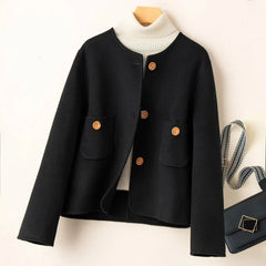 Elegant wool coat for women from Christine Brewer, featuring a tailored fit and classic design in a neutral color.