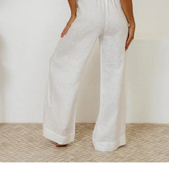 Light beige linen wide-leg trousers for women with a loose pull-on style, featuring a relaxed fit and comfortable waistband.