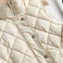 Ruby stand collar puffer vest for women by Christine Brewer, shown in a stylish, insulated design perfect for cold weather.