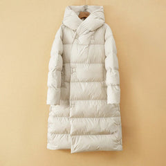 Long hooded parka for women by Christine Brewer, featuring a stylish design with a cozy hood and warm outer fabric.