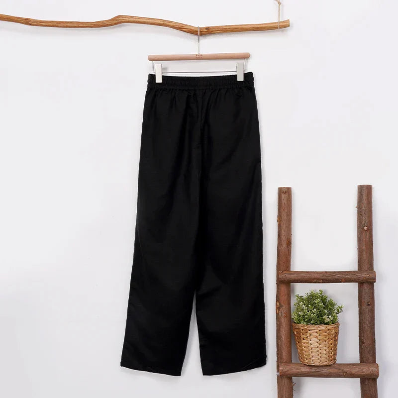 Women’s cotton linen wide-leg drawstring trousers by Christine Brewer, loose pull-on pants with a relaxed fit and casual style.