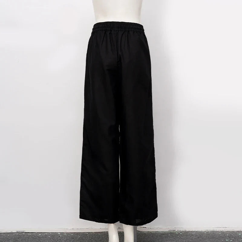 Women’s cotton linen wide-leg drawstring trousers by Christine Brewer, featuring a loose pull-on design and relaxed fit.