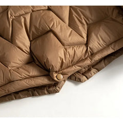 Light pink Christine Brewer Aurora short quilted puffer jacket for women with horizontal quilting and a high collar.