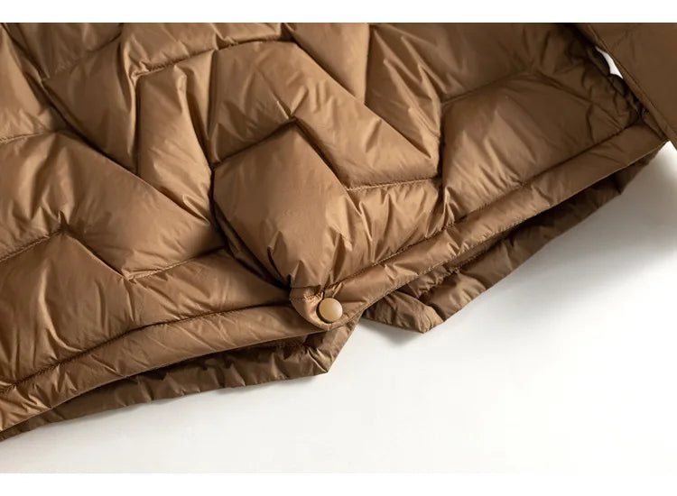 Light pink Christine Brewer Aurora short quilted puffer jacket for women with horizontal quilting and a high collar.