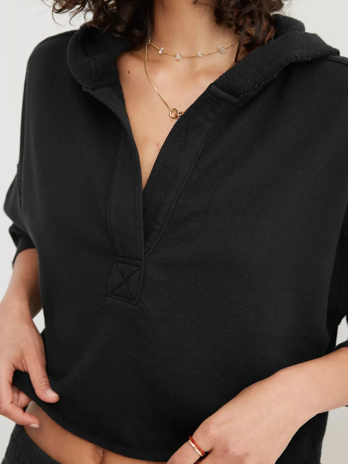 Christine Brewer Eleanor cropped women's hoodie, soft fabric with a relaxed fit, in a stylish design, shown on a model.