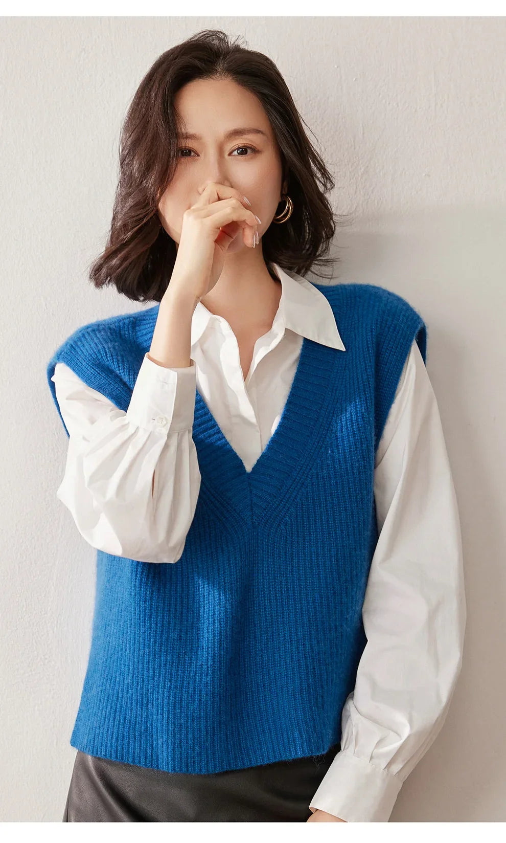 Cashmere ribbed knit sweater vest for women by Christine Brewer, featuring a stylish, textured design in neutral tones.