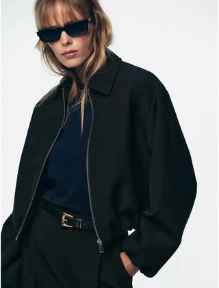 Violet zip-up puffer jacket for women by Christine Brewer, featuring a stylish quilted design and cozy fit.