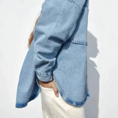 Women’s relaxed denim shirt jacket by Christine Brewer, featuring a casual fit, button front, and classic denim wash.