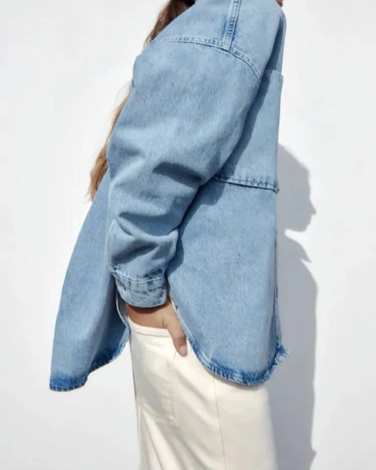 Women’s relaxed denim shirt jacket by Christine Brewer, featuring a casual fit, button front, and classic denim wash.
